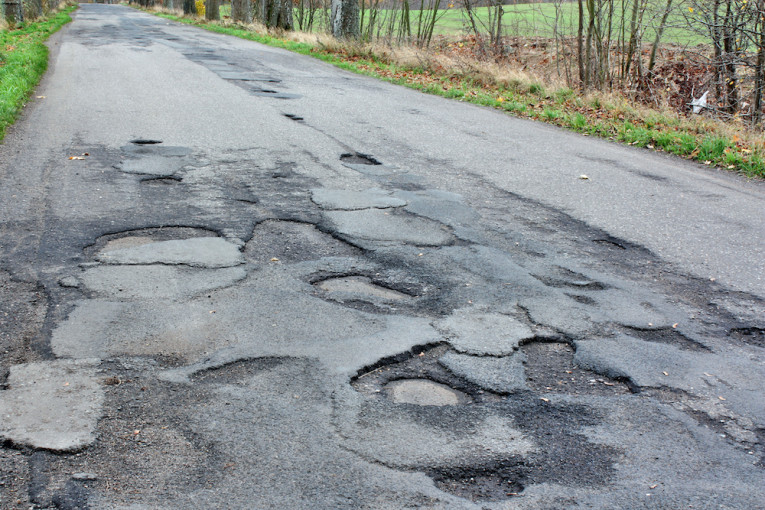 Asfalto atliekos Kuršių nerijos parke – daugiau nei 5 milijonų eurų žala aplinkai